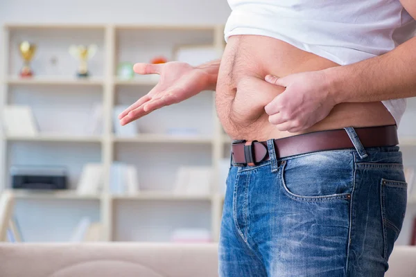 Man suffering from extra weight in diet concept — Stock Photo, Image