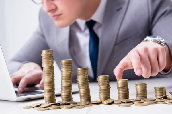 Businessman with golden coins in business growth concept — Stock Photo, Image