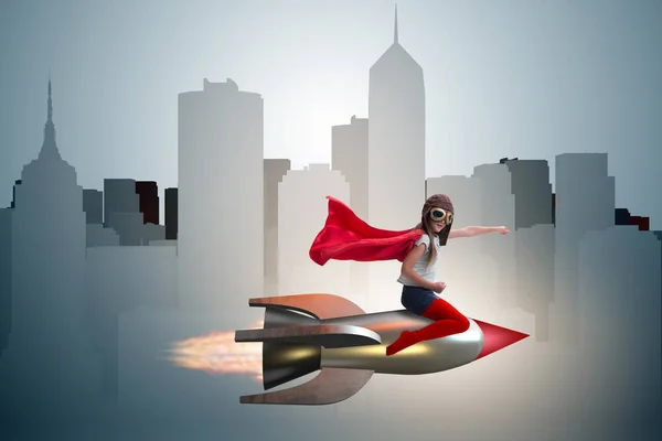 Liten flicka flygande raket i superhjälte koncept — Stockfoto