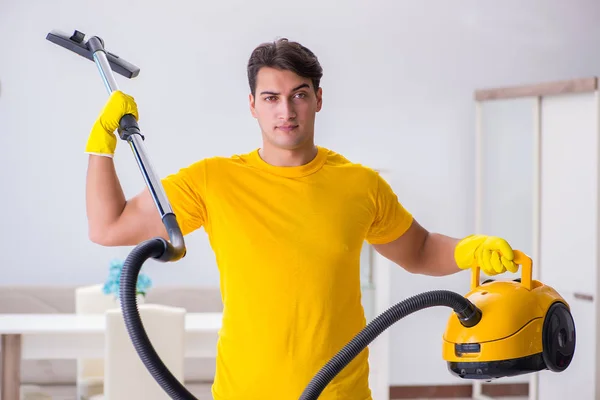Young man doing chores at home — Stock Photo, Image