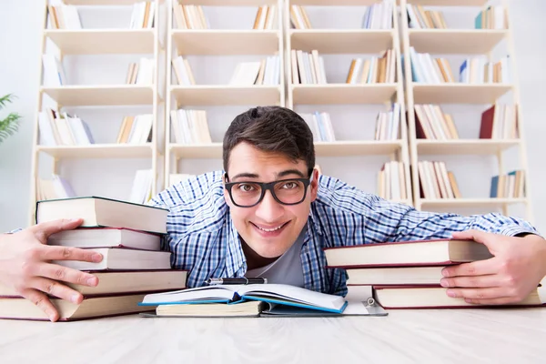 Young student studying with books — Stock Photo, Image