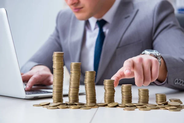 Businessman with golden coins in business growth concept — Stock Photo, Image