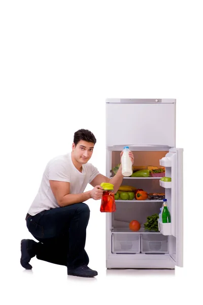 Adamın yanında buzdolabı kadar dolu — Stok fotoğraf