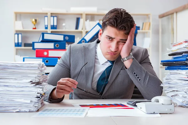 Businessman busy with much paperwork — Stock Photo, Image