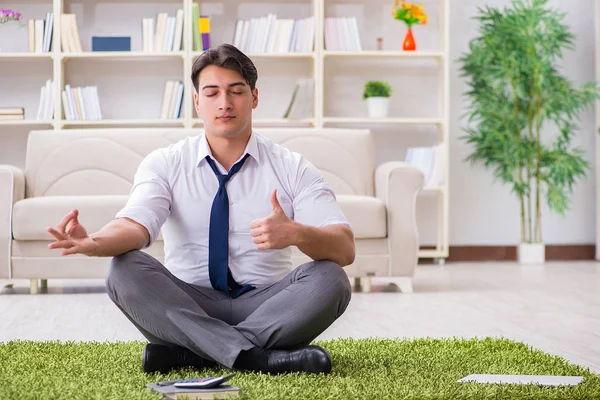 Businessman sitting on the floor in office — Stock Photo, Image