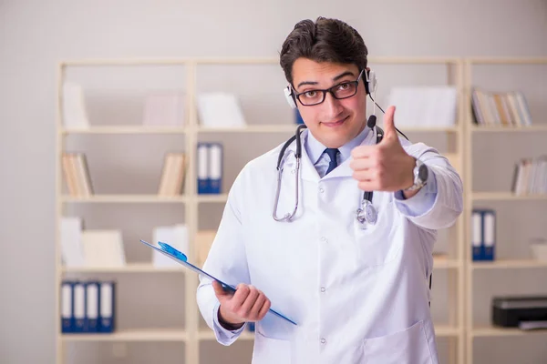 Young man doctor in medical concept