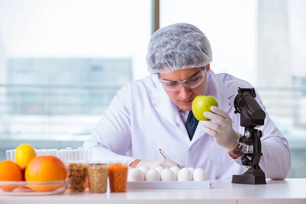 Nutrition expert testing food products in lab