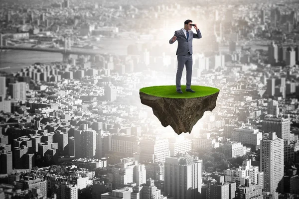 Ada dürbün ile uçan üzerinde işadamı