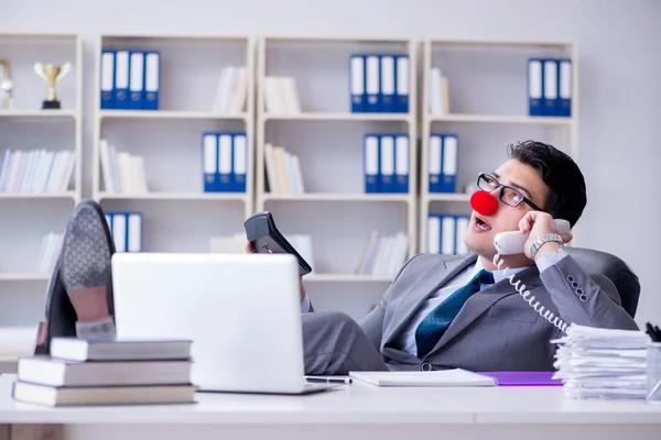 Clown businessman talking on phone working in office — Stock Photo, Image