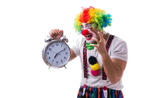 Payaso divertido con un reloj despertador aislado sobre fondo blanco — Foto de Stock