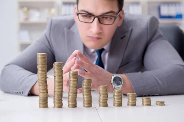 Businessman with golden coins in business growth concept — Stock Photo, Image