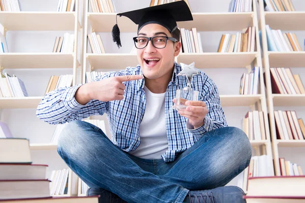 Young student studying with books — Stock Photo, Image