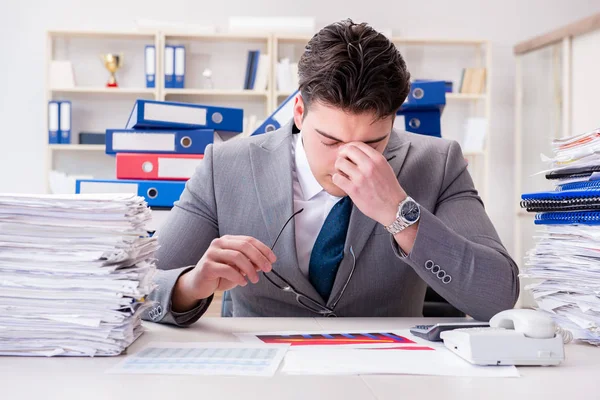 Businessman busy with much paperwork — Stock Photo, Image