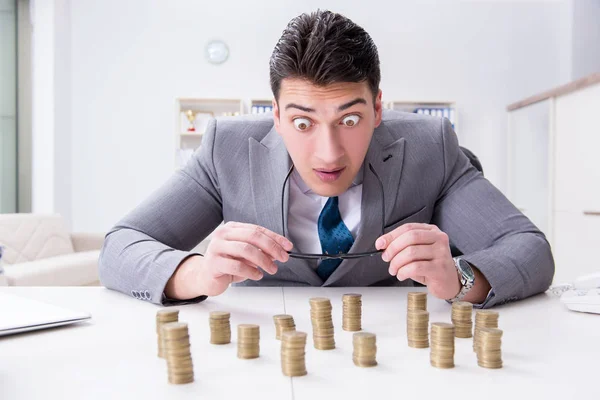 Businessman with golden coins in business growth concept — Stock Photo, Image