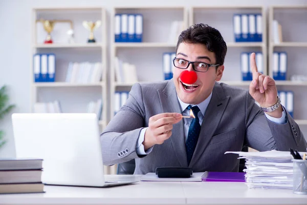 Clown businessman burning paper papers in the office — Stock Photo, Image