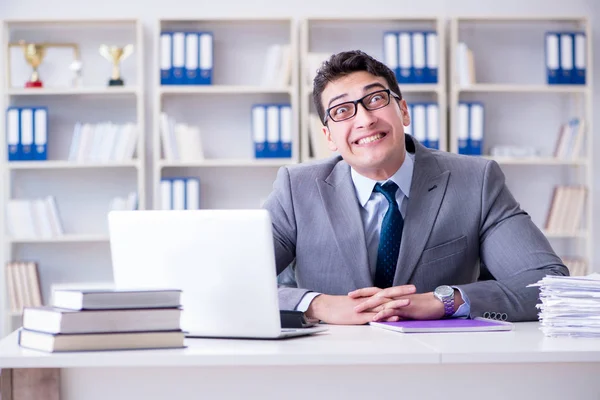 Funny businessman clown acting silly in the office