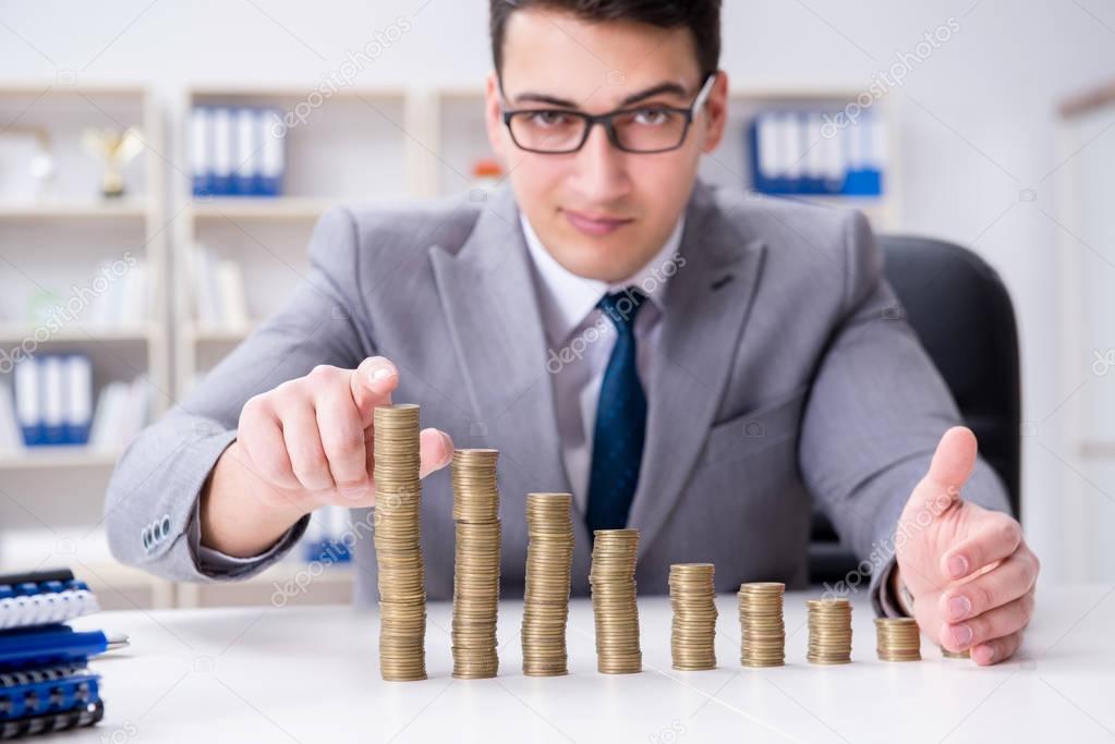 Businessman with golden coins in business growth concept