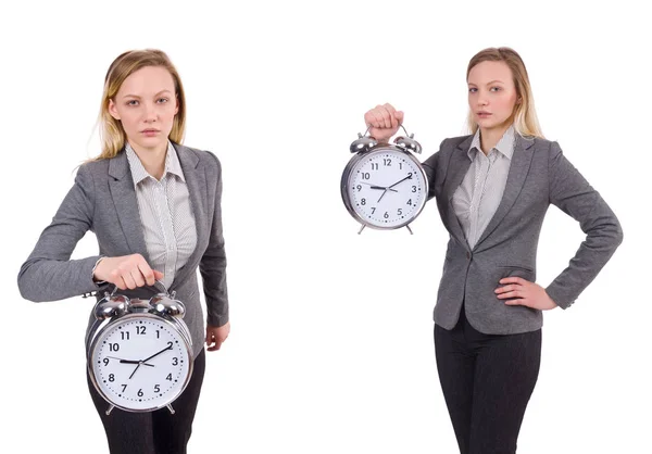 Mujer de negocios en traje gris con reloj despertador aislado en blanco —  Fotos de Stock