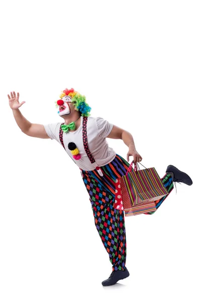 Rolig clown med shoppingväskor isolerad på vit bakgrund — Stockfoto