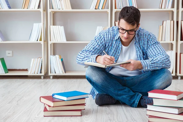 Young student studying with books — Stock Photo, Image