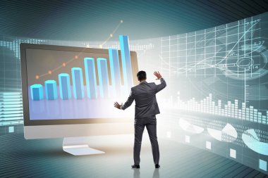 Grafiklerle ekonomi tahmini konseptinde iş adamı
