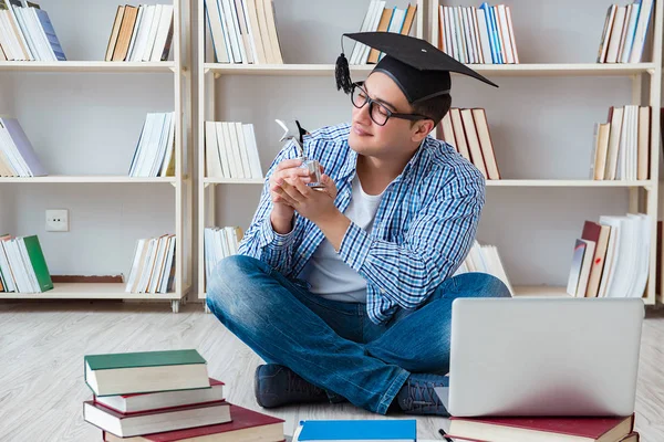 Young student studying with books — Stock Photo, Image