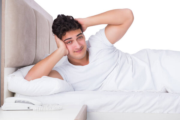 Man in bed suffering from insomnia