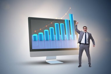 Grafiklerle ekonomi tahmini konseptinde iş adamı