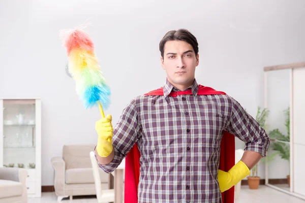 The super hero cleaner doing housework