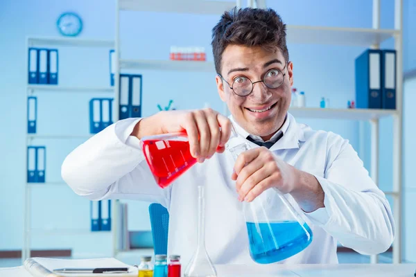 Funny mad chemist working in a laboratory — Stock Photo, Image