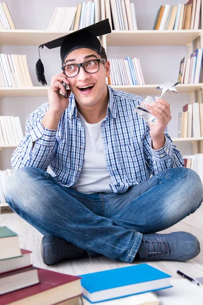 Young student studying with books — Stock Photo, Image