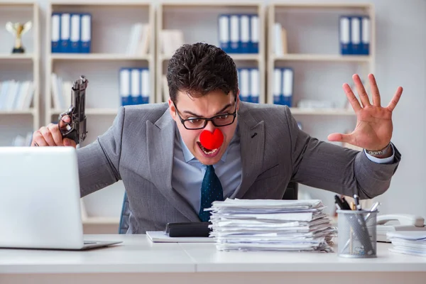 Clown businessman working in the office angry frustrated with a