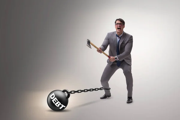 Debt concept with businessman escaping loan burden with axe — Stock Photo, Image