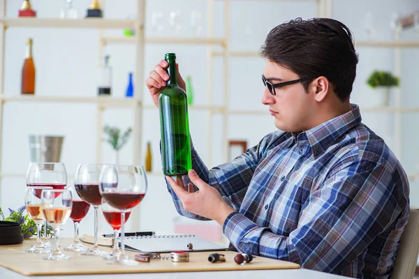 Professional sommelier tasting red wine — Stock Photo, Image