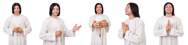 Jonge priester met Bijbel geïsoleerd op wit — Stockfoto