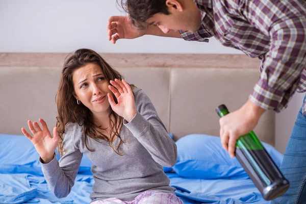 Domestic violence concept in a family argument with drunk alcoho