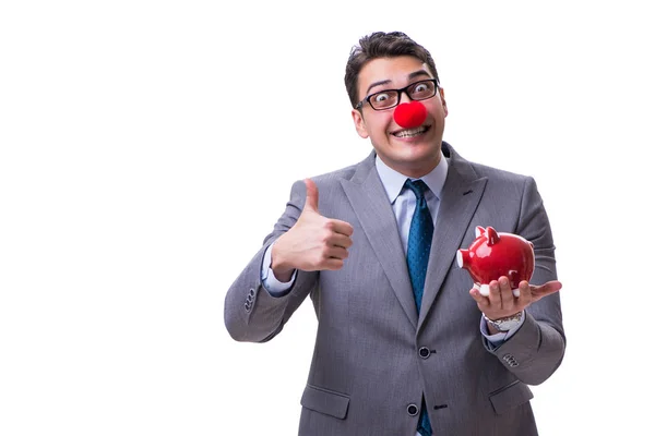 Buffo clown uomo d'affari con un salvadanaio isolato su bianco indietro — Foto Stock