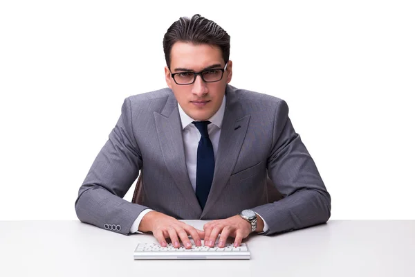 Ung affärsman skriva på ett tangentbord isolerad på vit bakgrund — Stockfoto