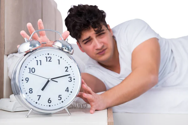 Man in bed suffering from insomnia