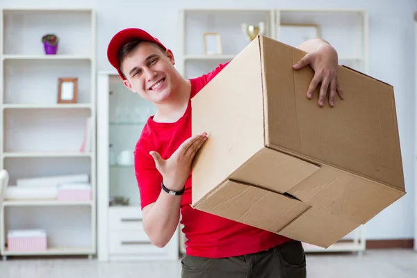 Post man delivering a parcel package — Stock Photo, Image