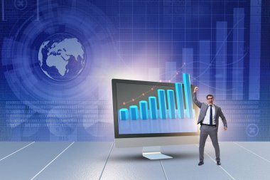 Grafiklerle ekonomi tahmini konseptinde iş adamı