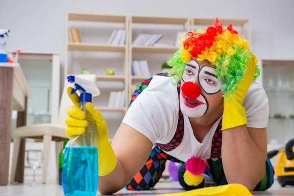 Funny clown doing cleaning at home — Stock Photo, Image