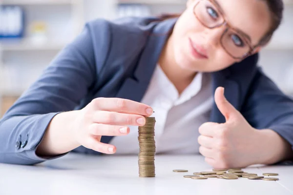 Businesswoman with coins in forex concept — Stock Photo, Image
