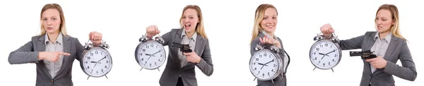 Podnikatelka v šedém obleku drží budík izolované na bílém — Stock fotografie