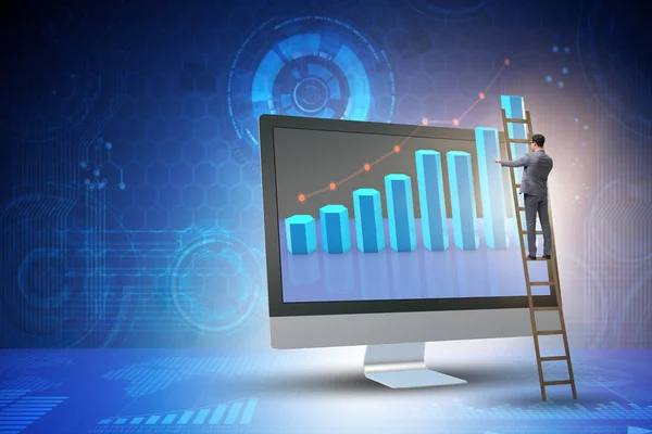 Businessman in economic forecasting concept with charts