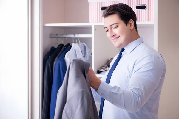 Young man businessman getting dressed for work — Stock Photo, Image