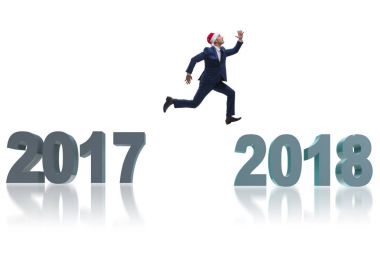 2017 'den 2018' e atlayan Noel Baba şapkalı bir iş adamı.