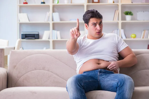 Man suffering from extra weight in diet concept — Stock Photo, Image