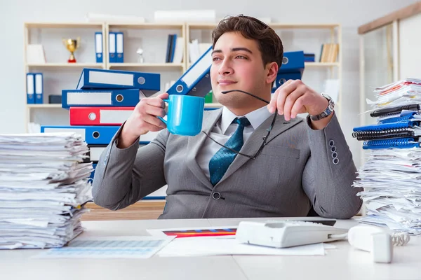 Businessman busy with much paperwork