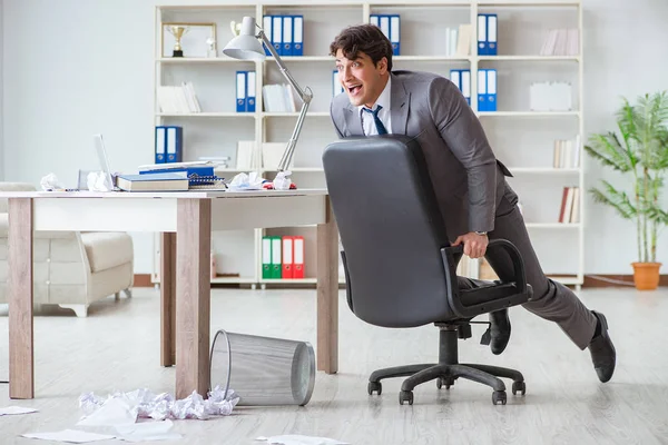 Businessman having fun taking a break in the office at work